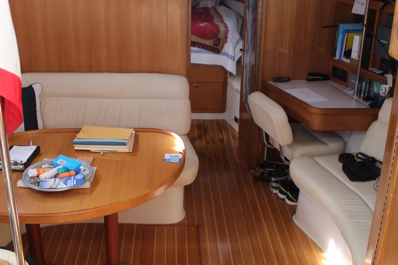 Cuckoo's Nest II Yacht Photos Pics Interior of 2002 Catalina MkII yacht with wooden flooring and cozy seating area.