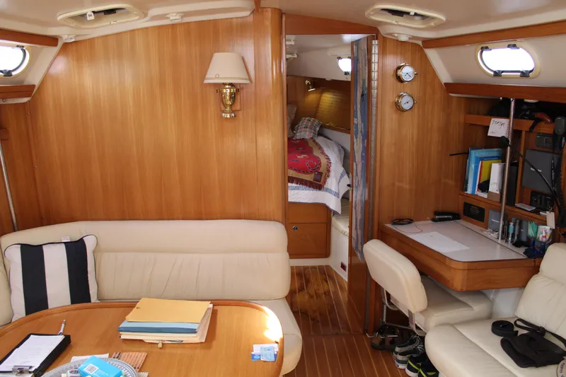 Cuckoo's Nest II Yacht Photos Pics Interior of 2002 Catalina MkII sailboat with cozy seating and navigation area.