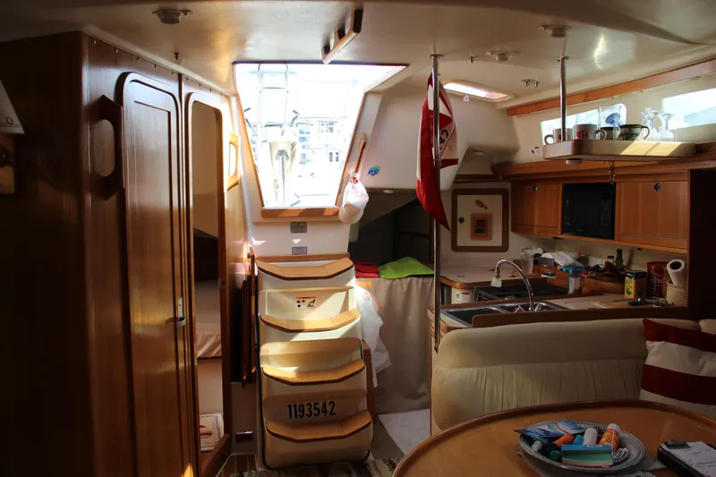 Cuckoo's Nest II Yacht Photos Pics Interior of 2002 Catalina MkII sailboat with cozy kitchen and dining area.