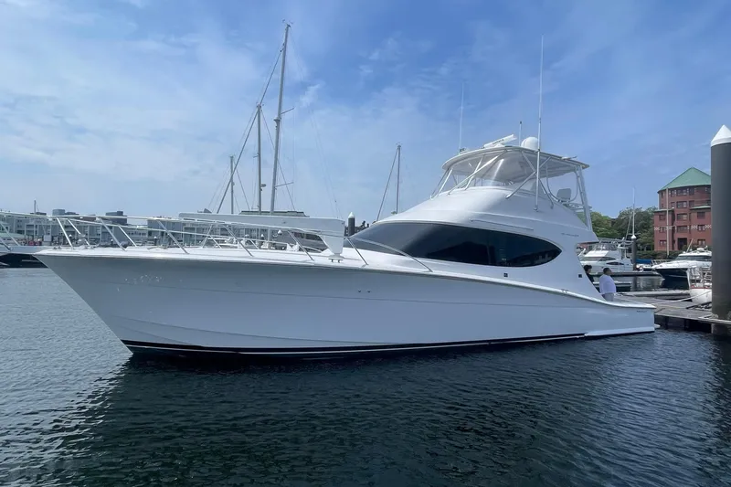  Yacht Photos Pics 2013 Hatteras GT54 yacht docked at marina under clear blue sky.
