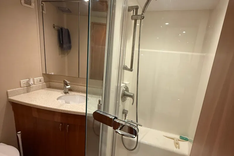  Yacht Photos Pics Luxurious bathroom in 2013 Hatteras GT54 yacht with modern shower and vanity.