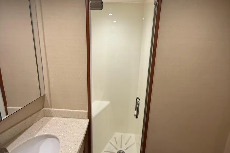  Yacht Photos Pics Bathroom interior of 2013 Hatteras GT54 yacht with shower and sink.