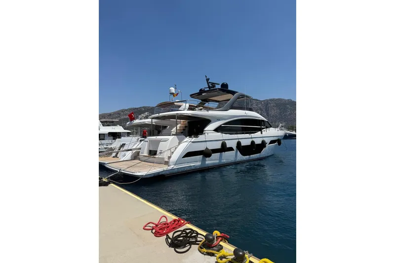  Yacht Photos Pics Luxury 2020 Princess Y78 yacht docked at marina with scenic mountain backdrop.