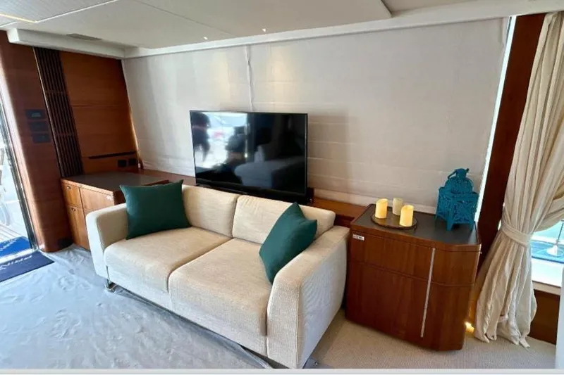  Yacht Photos Pics Luxurious interior of 2020 Princess Y78 yacht with sofa, TV, and elegant decor.