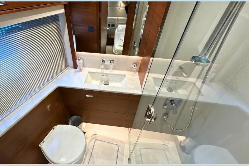 Yacht Photos Pics Luxurious bathroom in 2020 Princess Y78 yacht with modern fixtures and glass shower.