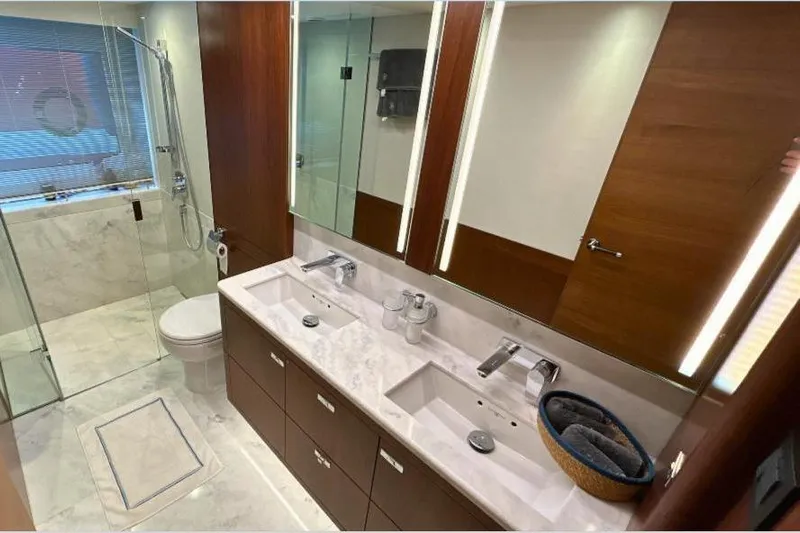  Yacht Photos Pics Luxurious bathroom in 2020 Princess Y78 yacht with dual sinks and glass shower.