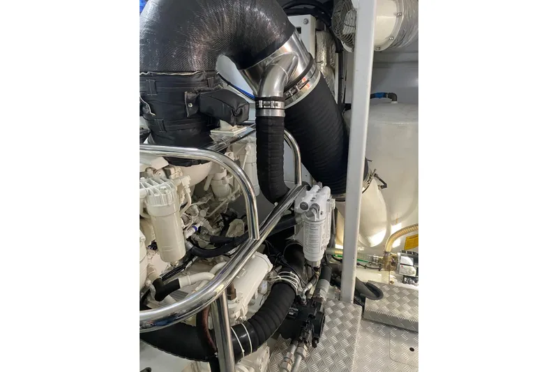  Yacht Photos Pics Engine room of 2020 Princess Y78 yacht with visible components and piping.