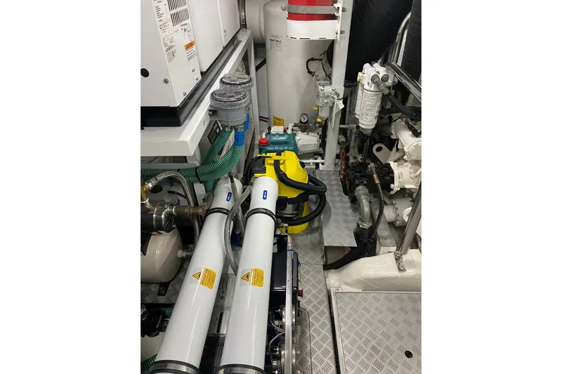  Yacht Photos Pics Engine room of 2020 Princess Y78 yacht with various mechanical components and equipment.