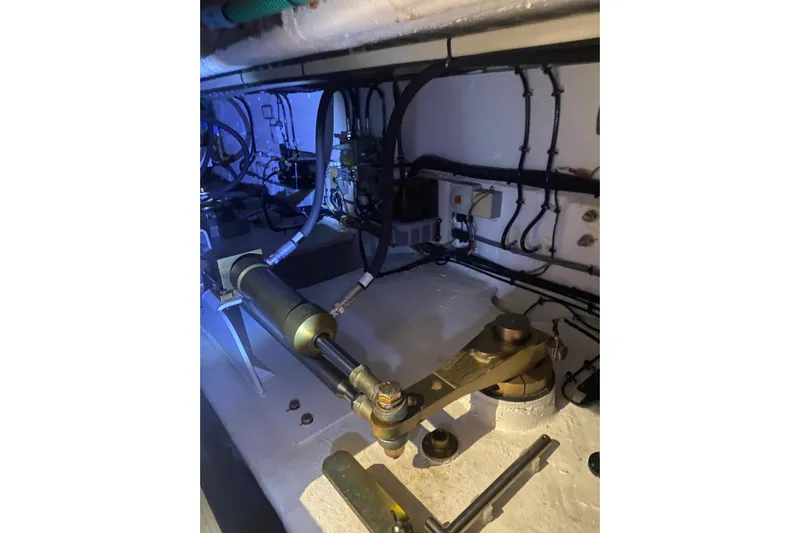  Yacht Photos Pics Engine room of 2020 Princess Y78 yacht, showcasing mechanical components and wiring.