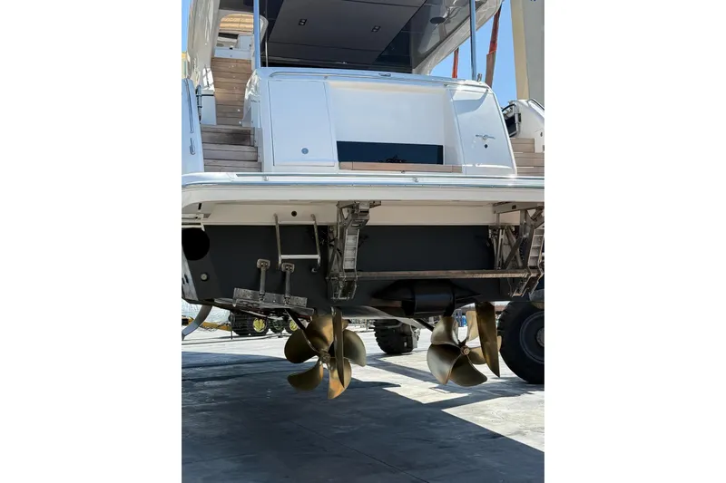  Yacht Photos Pics Stern view of 2020 Princess Y78 yacht with visible propellers and boarding platform.