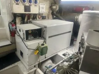 Dry-hydro Yacht Photos Pics Engine room of a 1990 Viking Convertible boat with generator and equipment.