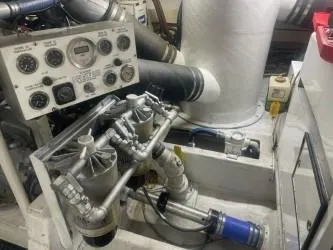 Dry-hydro Yacht Photos Pics Engine room of a 1990 Viking Convertible boat with gauges and pipes.