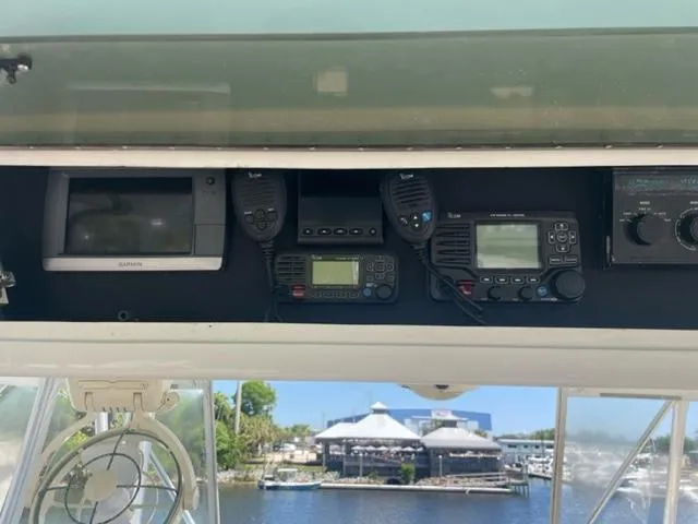 Dry-hydro Yacht Photos Pics 1990 Viking Convertible boat dashboard with navigation and communication equipment.