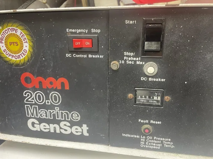 Dry-hydro Yacht Photos Pics Onan 20.0 Marine GenSet control panel with emergency stop and start features.