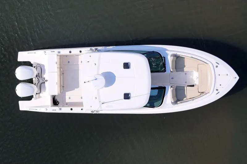  Yacht Photos Pics Top view of 2018 Pursuit DC 295 Dual Console boat on water.