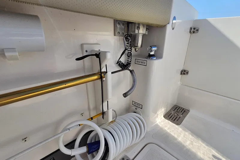  Yacht Photos Pics 2018 Pursuit DC 295 Dual Console boat interior with fresh and raw water outlets.