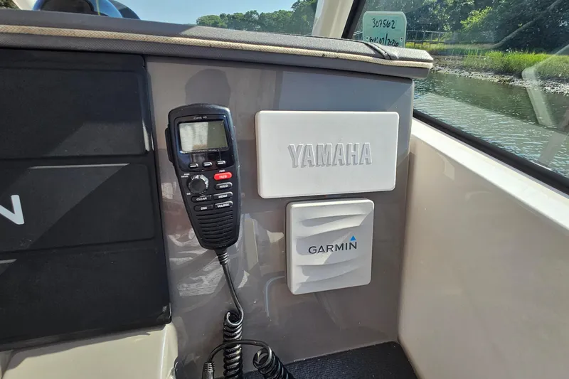  Yacht Photos Pics 2018 Pursuit DC 295 Dual Console boat interior with Yamaha and Garmin equipment.