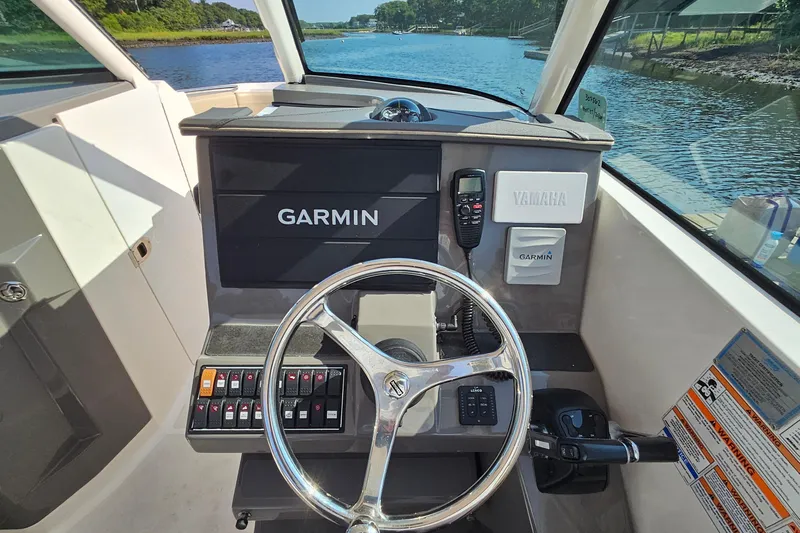  Yacht Photos Pics 2018 Pursuit DC 295 Dual Console boat dashboard with Garmin and Yamaha controls.
