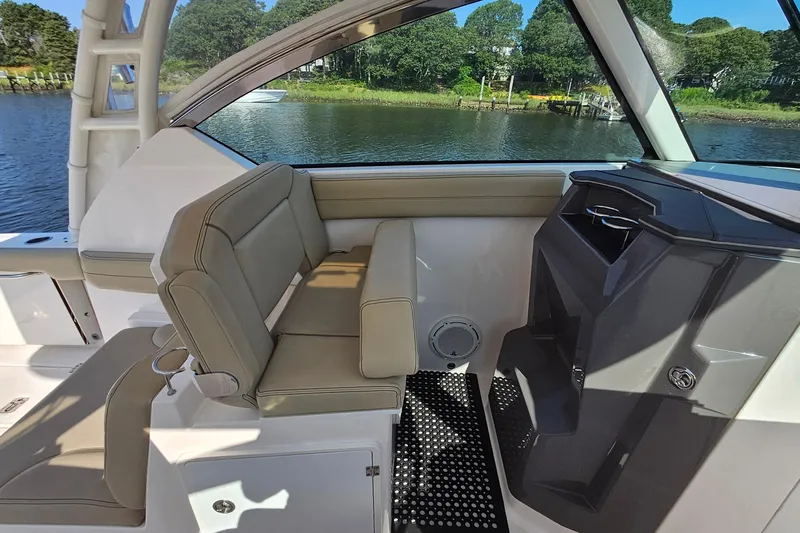  Yacht Photos Pics 2018 Pursuit DC 295 Dual Console interior with seating and water view.