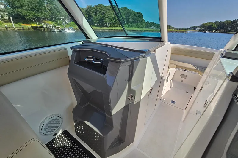  Yacht Photos Pics 2018 Pursuit DC 295 Dual Console interior with cup holders, scenic water view.