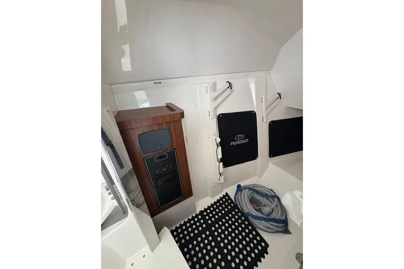  Yacht Photos Pics 2018 Pursuit DC 295 Dual Console interior with storage and equipment.