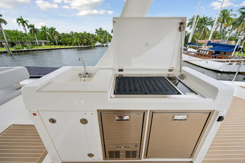 Euphoria Yacht Photos Pics Outdoor kitchen on 2024 Leopard 53 Powercat yacht with grill and sink.