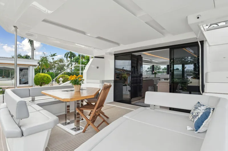 Euphoria Yacht Photos Pics Luxurious 2024 Leopard 53 Powercat yacht interior with elegant seating and dining area.