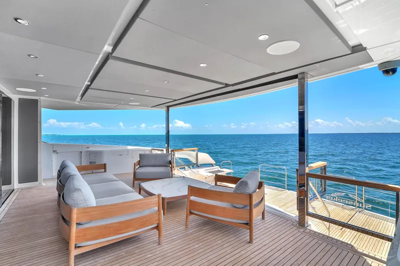 Worth The Wait Yacht Photos Pics Luxurious Sunseeker Ocean 182 yacht deck with elegant seating, overlooking the ocean, 2024 model.