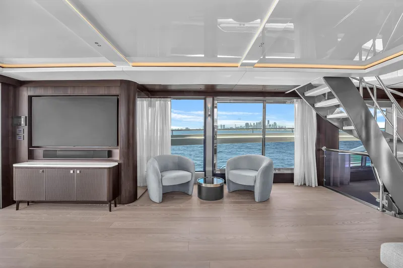 Worth The Wait Yacht Photos Pics Luxurious interior of 2024 Sunseeker Ocean 182 yacht with modern seating and ocean view.