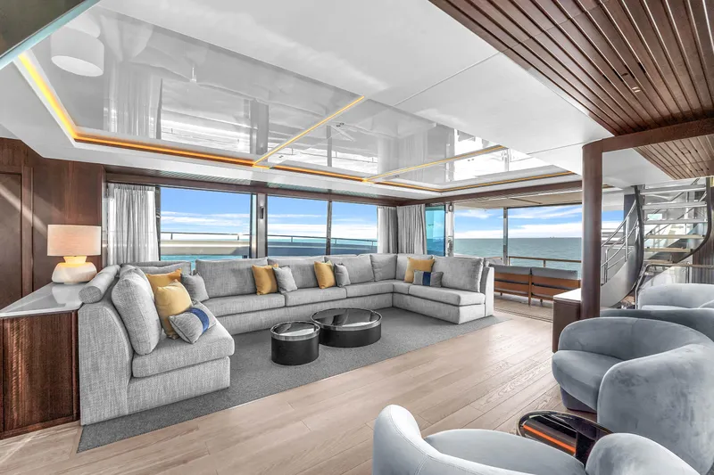Worth The Wait Yacht Photos Pics Luxurious interior of 2024 Sunseeker Ocean 182 yacht with modern seating and ocean views.