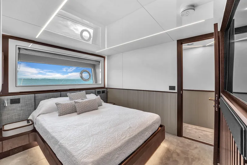 Worth The Wait Yacht Photos Pics Luxurious bedroom interior of 2024 Sunseeker Ocean 182 yacht with ocean view.
