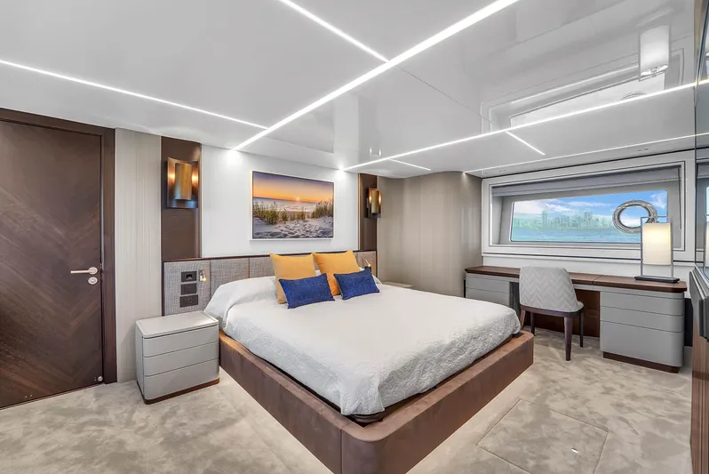 Worth The Wait Yacht Photos Pics Luxurious bedroom interior of 2024 Sunseeker Ocean 182 yacht with modern design and elegant furnishings.