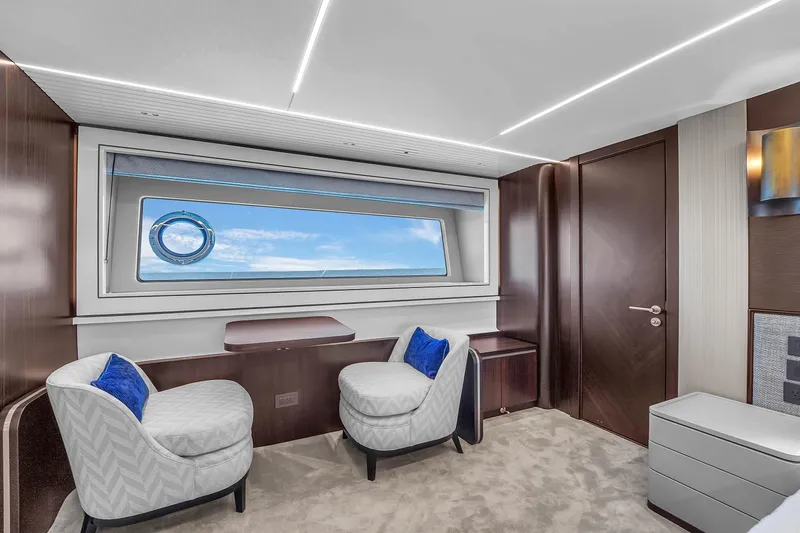 Worth The Wait Yacht Photos Pics Luxurious interior of 2024 Sunseeker Ocean 182 yacht with modern seating and ocean view.