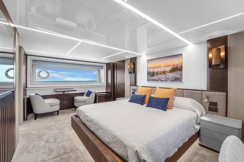 Worth The Wait Yacht Photos Pics Luxurious bedroom interior of 2024 Sunseeker Ocean 182 yacht with modern decor and ocean view.