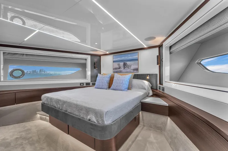 Worth The Wait Yacht Photos Pics Luxurious bedroom interior of 2024 Sunseeker Ocean 182 yacht with modern design and scenic windows.