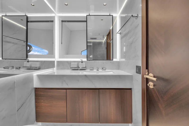 Worth The Wait Yacht Photos Pics Luxurious bathroom interior of 2024 Sunseeker Ocean 182 yacht with modern fixtures and elegant design.