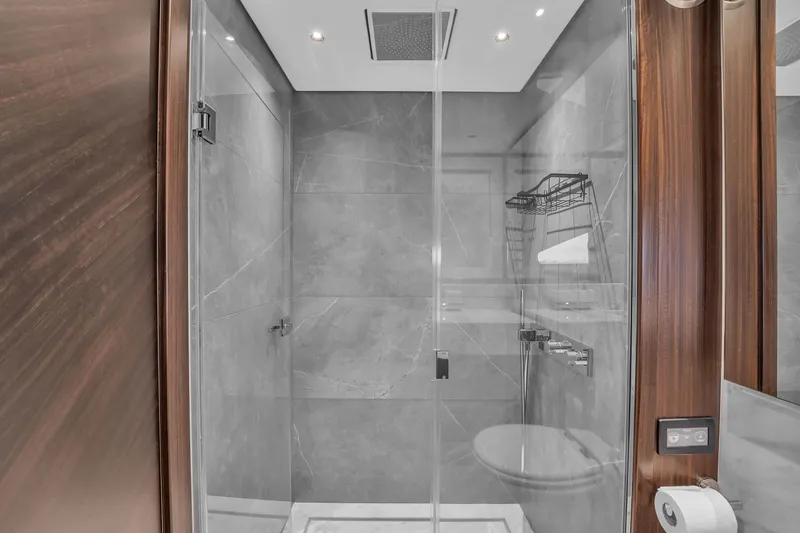 Worth The Wait Yacht Photos Pics Luxurious bathroom in 2024 Sunseeker Ocean 182 yacht with modern shower design.