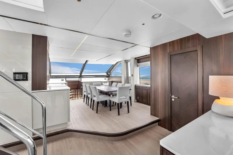 Worth The Wait Yacht Photos Pics Luxurious interior of 2024 Sunseeker Ocean 182 yacht with elegant dining area.