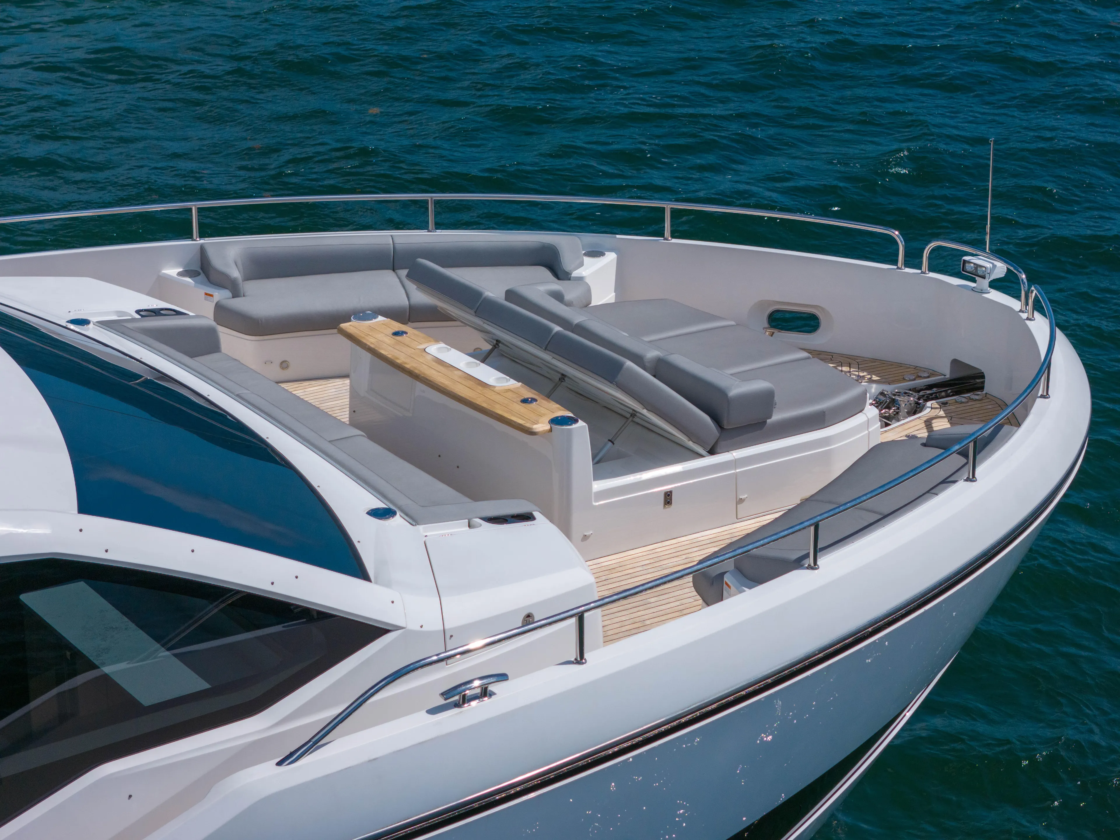 Worth The Wait Yacht Photos Pics 2024 Sunseeker Ocean 182 yacht with luxurious deck seating on open water.