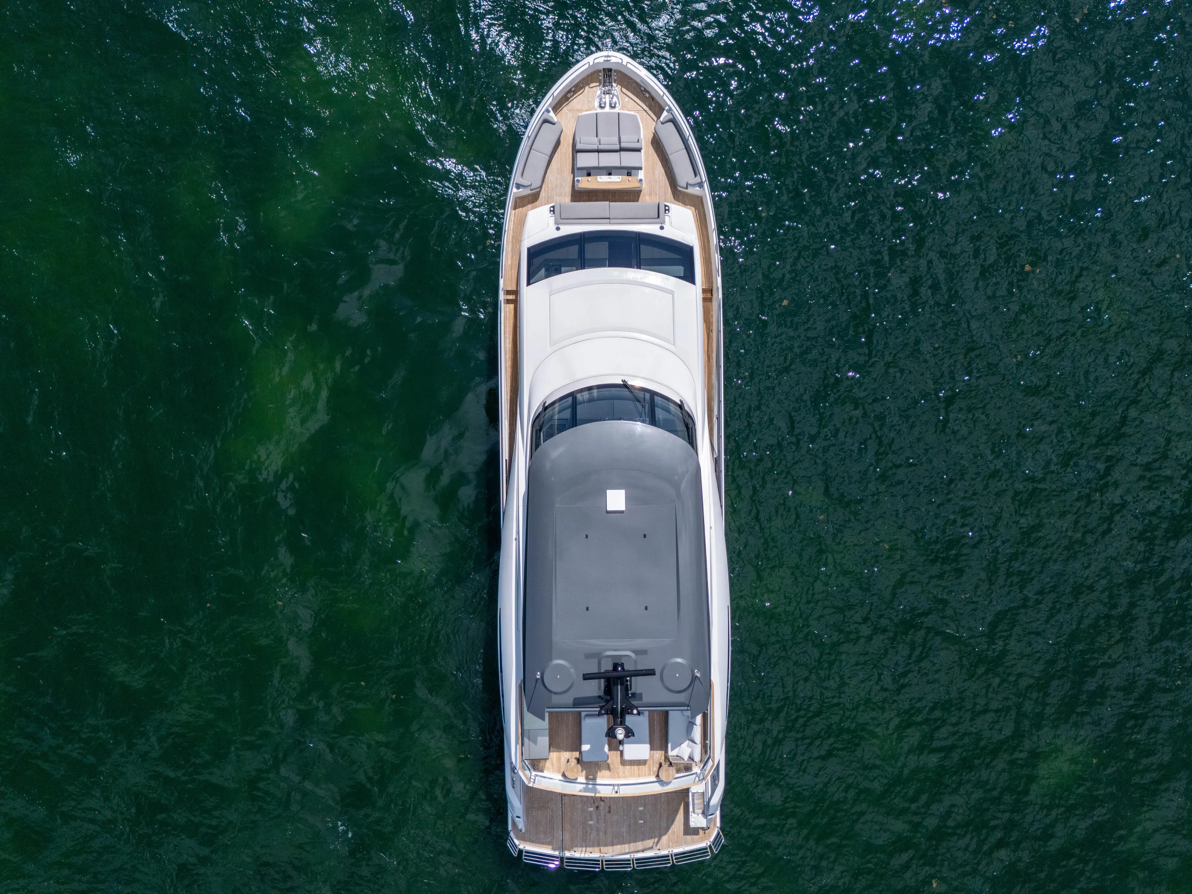 Worth The Wait Yacht Photos Pics Aerial view of 2024 Sunseeker Ocean 182 yacht on open water.