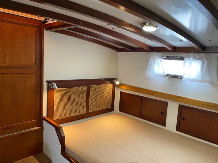 Lord Stanley Yacht Photos Pics 1988 Lyman-Morse Jarvis Newman Lobster Cruiser aft cabin interior with wood accents and cozy bed.