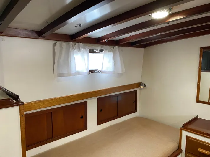 Lord Stanley Yacht Photos Pics 1988 Lyman-Morse Jarvis Newman Lobster Cruiser aft cabin with wooden accents and cozy bed.