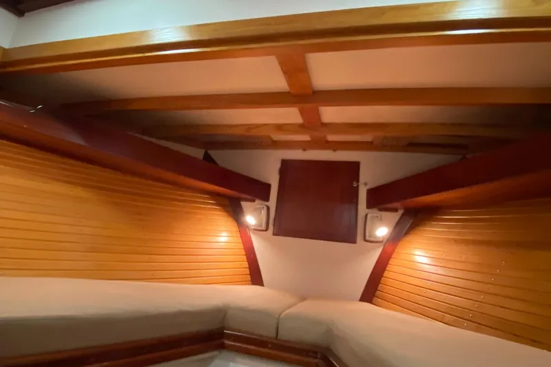 Lord Stanley Yacht Photos Pics 1988 Lyman-Morse Jarvis Newman Lobster Cruiser interior with wood paneling and cozy seating.