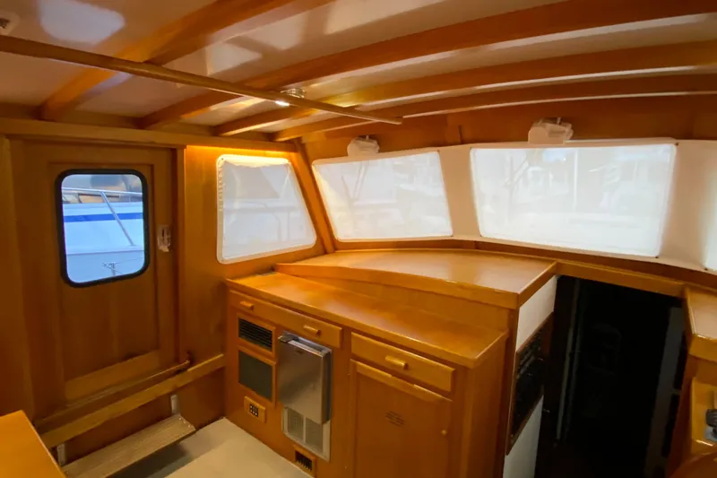 Lord Stanley Yacht Photos Pics 1988 Lyman-Morse Jarvis Newman Lobster Cruiser interior with wood finish and aft cabin.