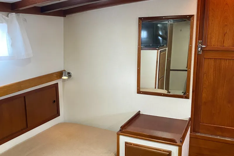 Lord Stanley Yacht Photos Pics 1988 Lyman-Morse Jarvis Newman Lobster Cruiser interior with wood accents and mirror.