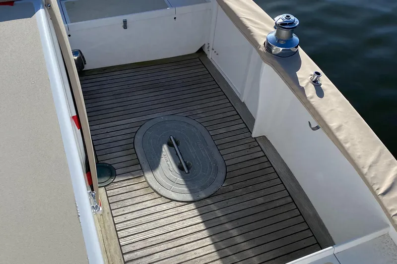 Lord Stanley Yacht Photos Pics 1988 Lyman-Morse Jarvis Newman Lobster Cruiser aft cabin deck with wooden flooring and winch.