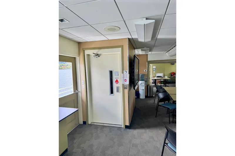 M/v Explorer Yacht Photos Pics Interior of 2016 Custom Commercial Research Riverboat with elevator and seating area.