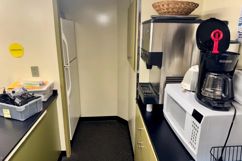 M/v Explorer Yacht Photos Pics Kitchen area on a 2016 Custom Commercial Research Riverboat with appliances and storage.