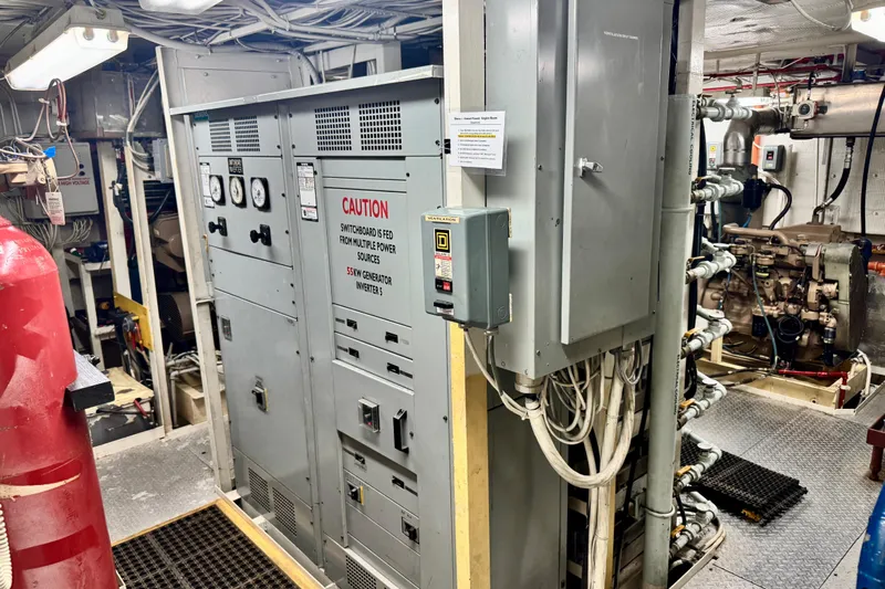 M/v Explorer Yacht Photos Pics Engine room of a 2016 Custom Commercial Research Riverboat with control panels and machinery.