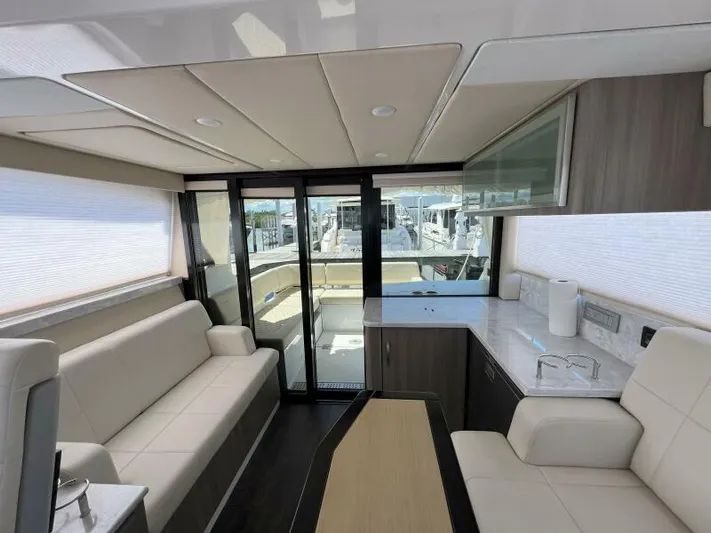 Great Expectations Yacht Photos Pics Interior of 2020 Regal 38 XO yacht with modern seating and sleek design.